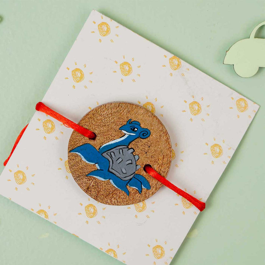 Personalized Hand Painted Lapras Wooden Rakhi With Roli Chawal - In Packaging