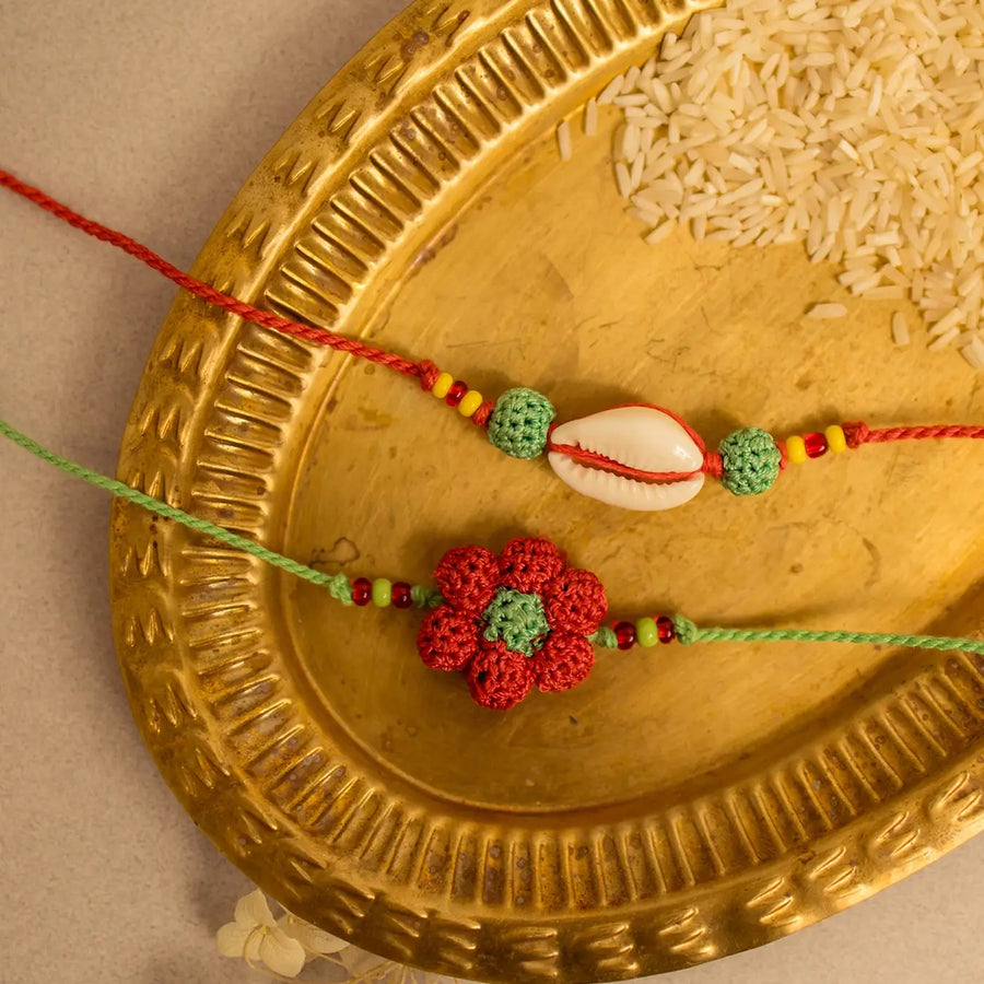 Handmade Crochet Phool Kaudi Rakhi With Roli Chawal Set Of 2 - Close-up of Rakhi designs