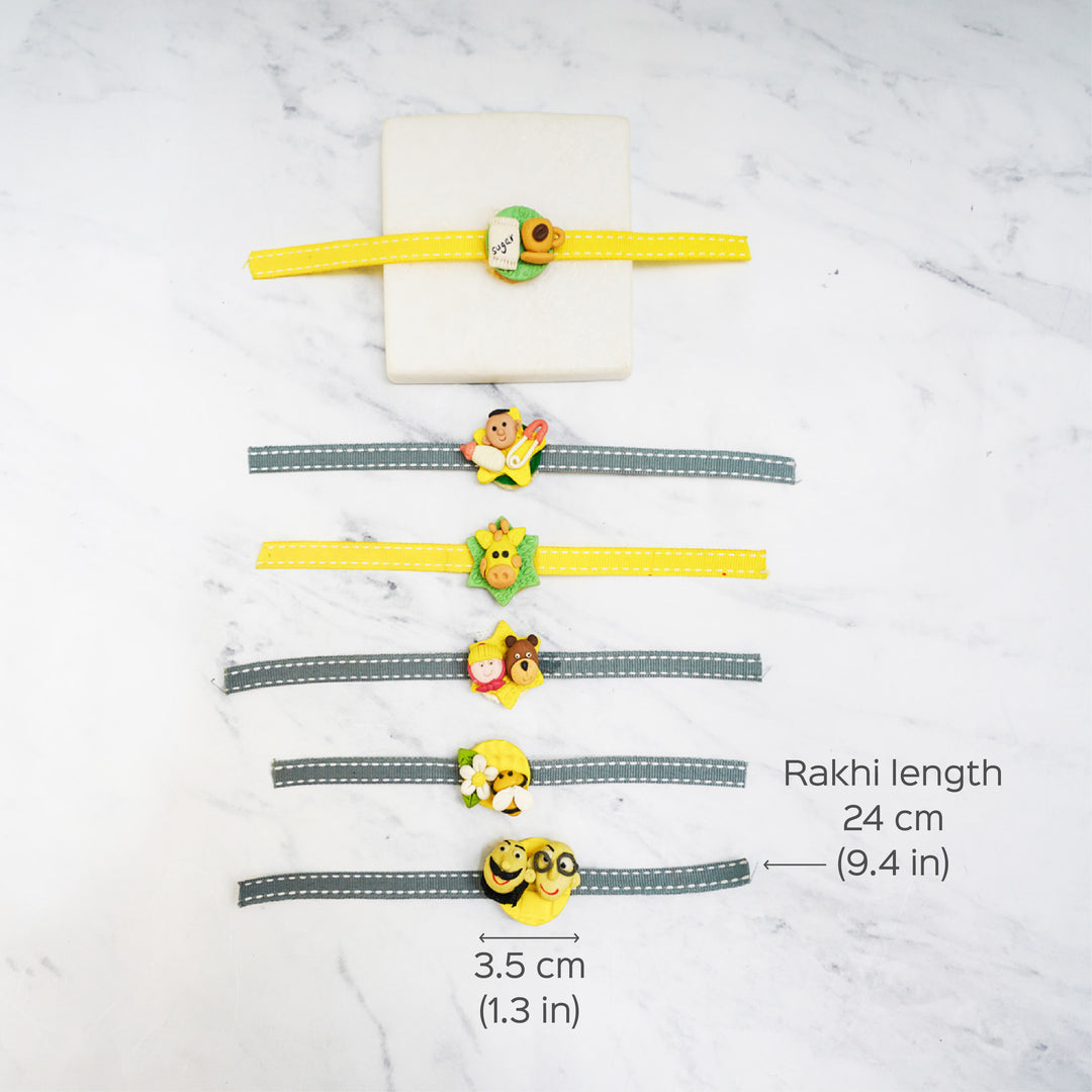 Handmade Porcelain Clay Themed Rakhi 13 - Multiple charms with length dimensions