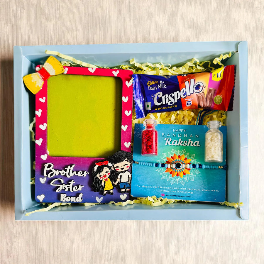 Photo Personalized Brother Sister Bond Mdf Wood Rakhi Hamper With Chocolates And Roli Chawal Includes 1 Fridge Magnet 1 Rakhi - Flat Lay Product Arrangement