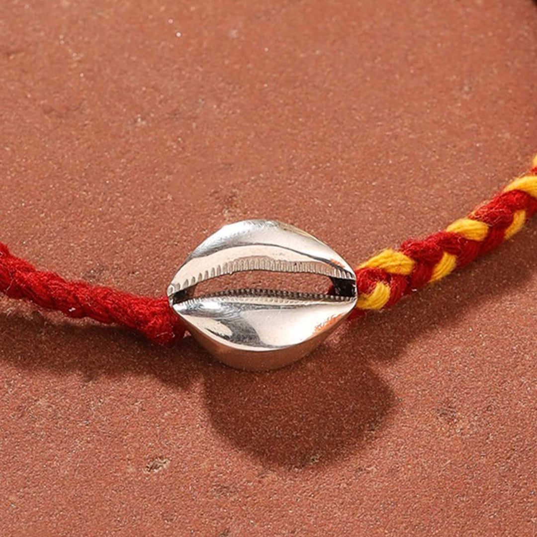 Handmade Shell Design Silver Rakhi For Brother - Close-up of Shell Charm Detail