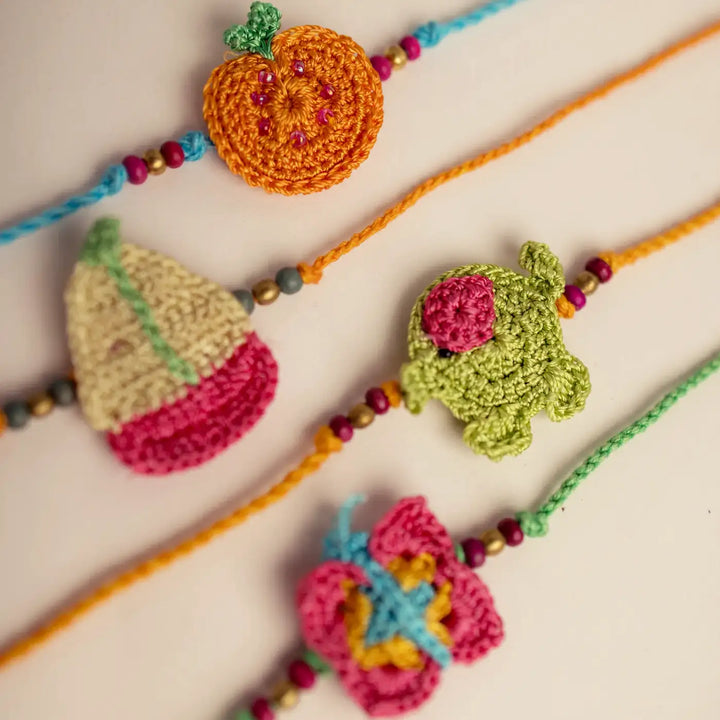 Handmade Crochet Funtime Rakhi With Roli Chawal Set Of 4 - Macro detail on crochet charms