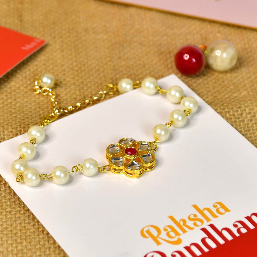 Beaded Pearl And Stone Bracelet Rakhi Hamper With Chocolates And Roli Chawal For Brother Customizable Options Includes Up To 7 Goodies - Close-up on Rakhi bracelet