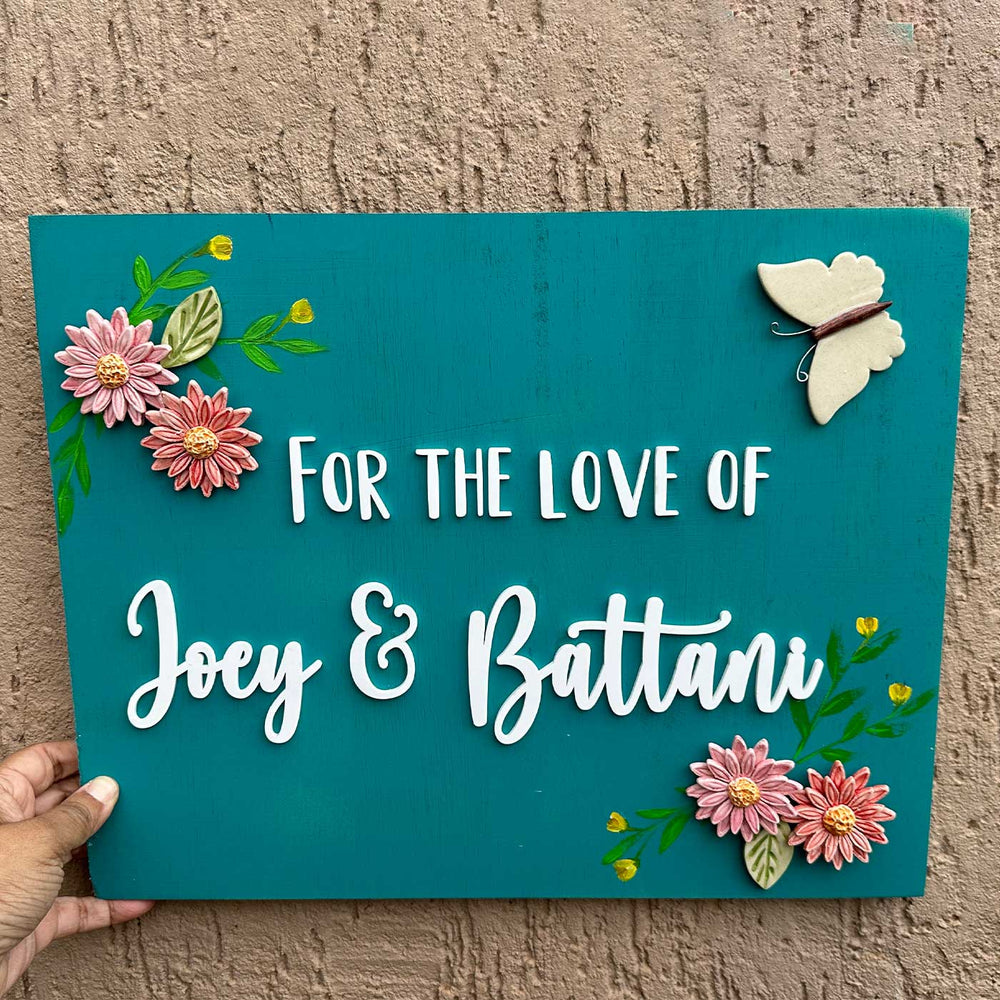 Personalized Handmade Floral Wooden Name Plate For Couples - Handheld Front View with Decorations
