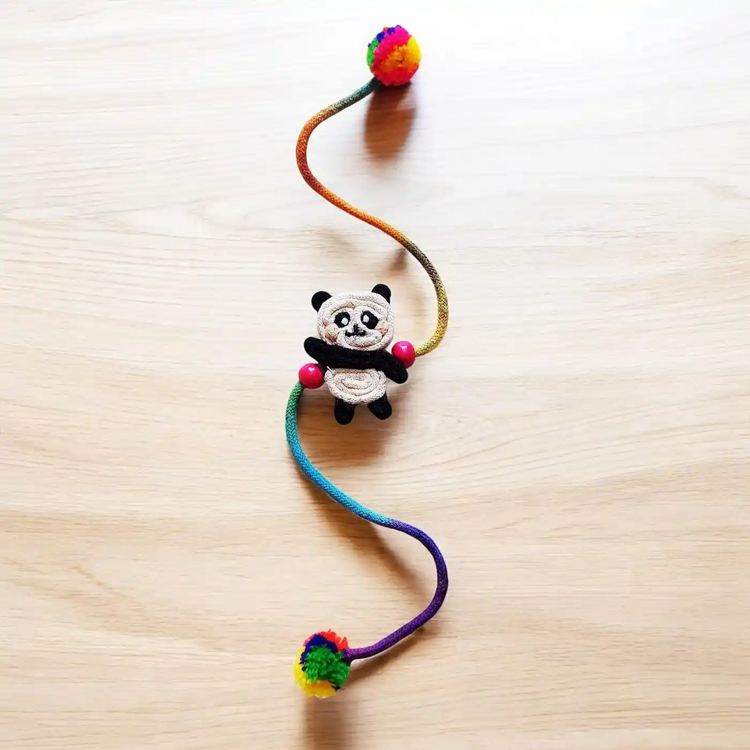 Handmade Dori Work Cute Panda Kids Rakhi With Roli Chawal - Full Length View on Surface
