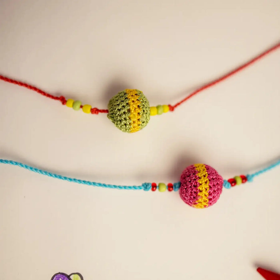 Handmade Crochet Multicolor Suraj Rakhi With Roli Chawal Set Of 2 - Close-up on Crochet Bead Detail