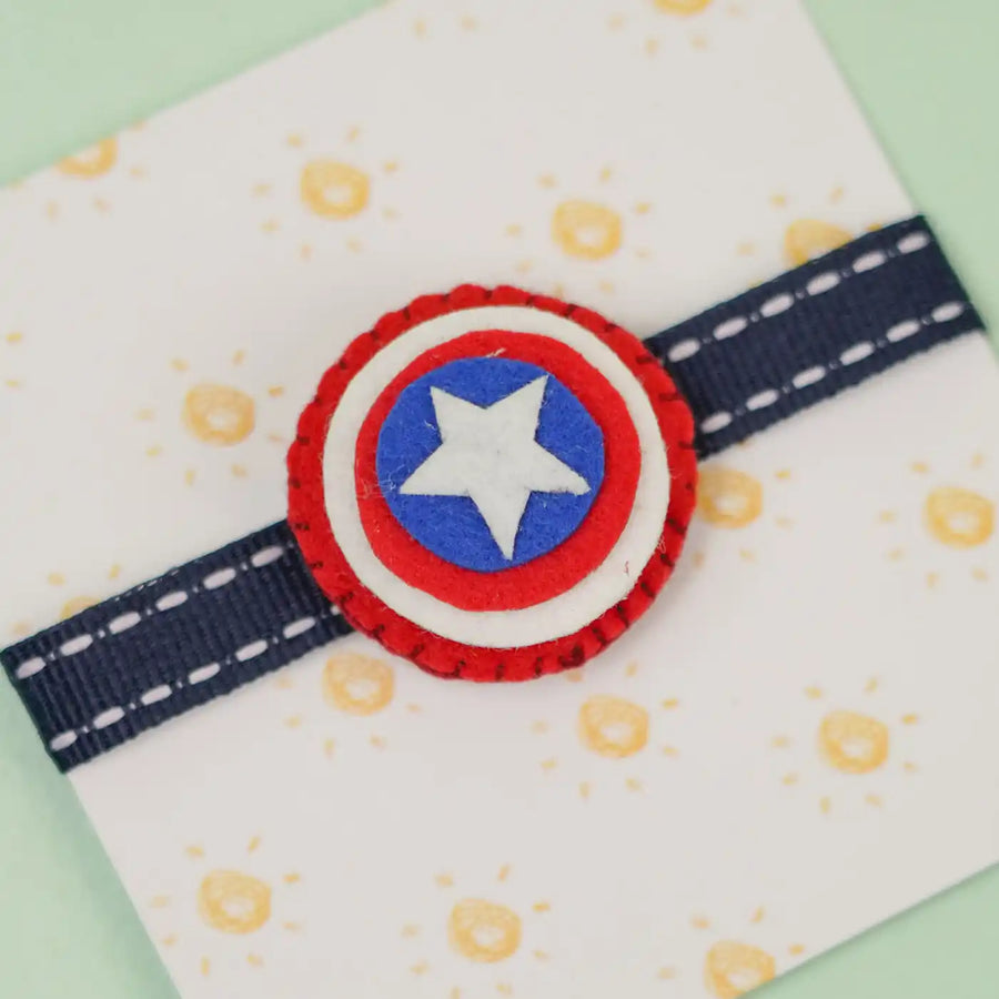 Handmade Superhero Theme Felt Kids Rakhi With Roli Chawal - Close-up View