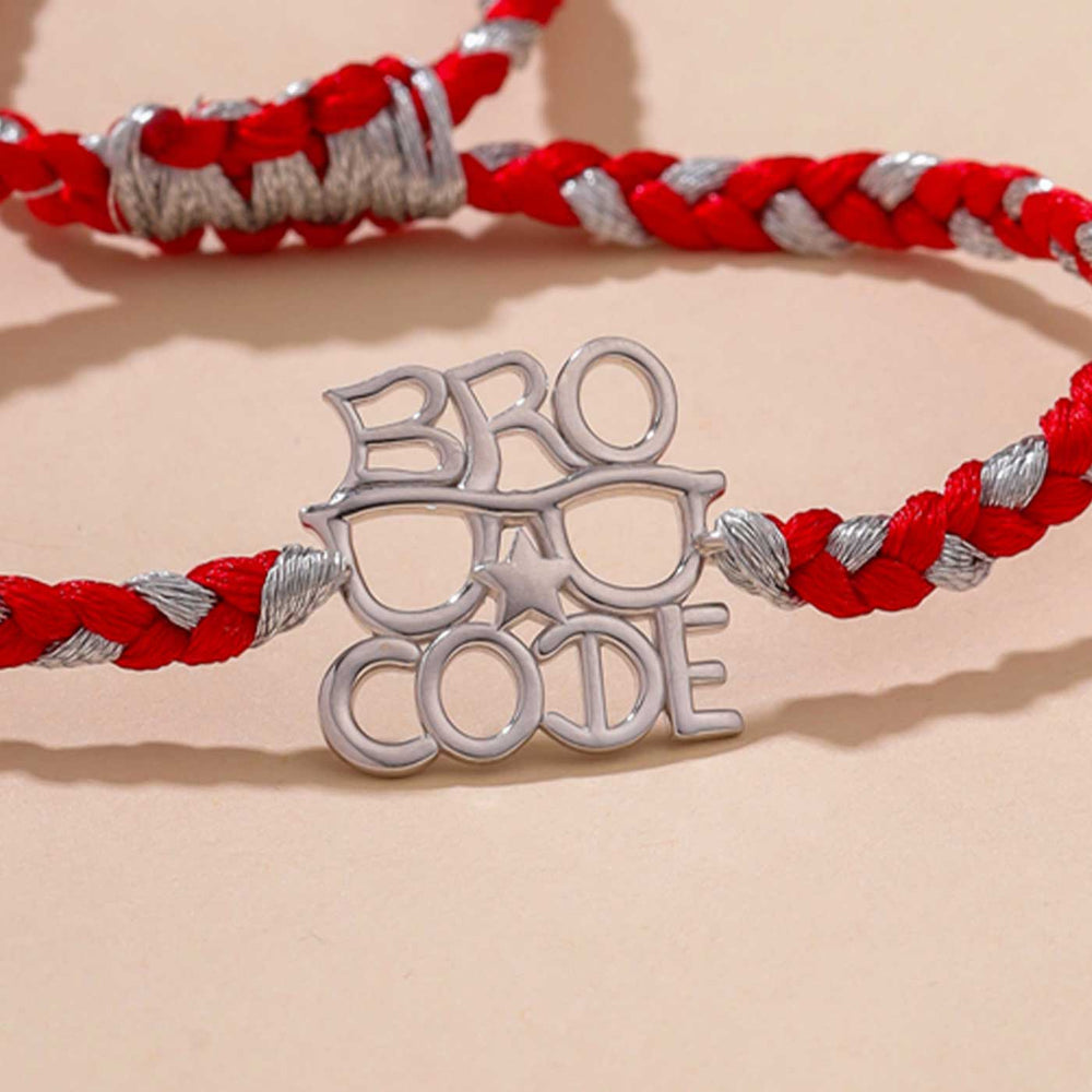 Handmade Bro Code Design Silver Rakhi For Brother - Close-up of Metal Charm