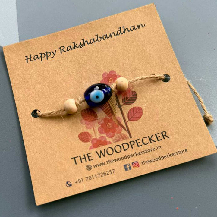Personalized Hand Painted Evil Eye Rakhi With Roli Chawal Set Of 2 - Single Multi-Bead Rakhi Displayed