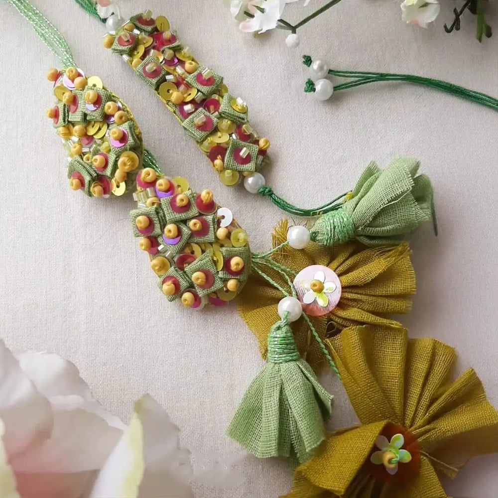 Hand Embroidered Beaded Pista Bhaiya Bhabhi Rakhi With Roli Chawal Set Of 2 - Close-up of Ornament Details