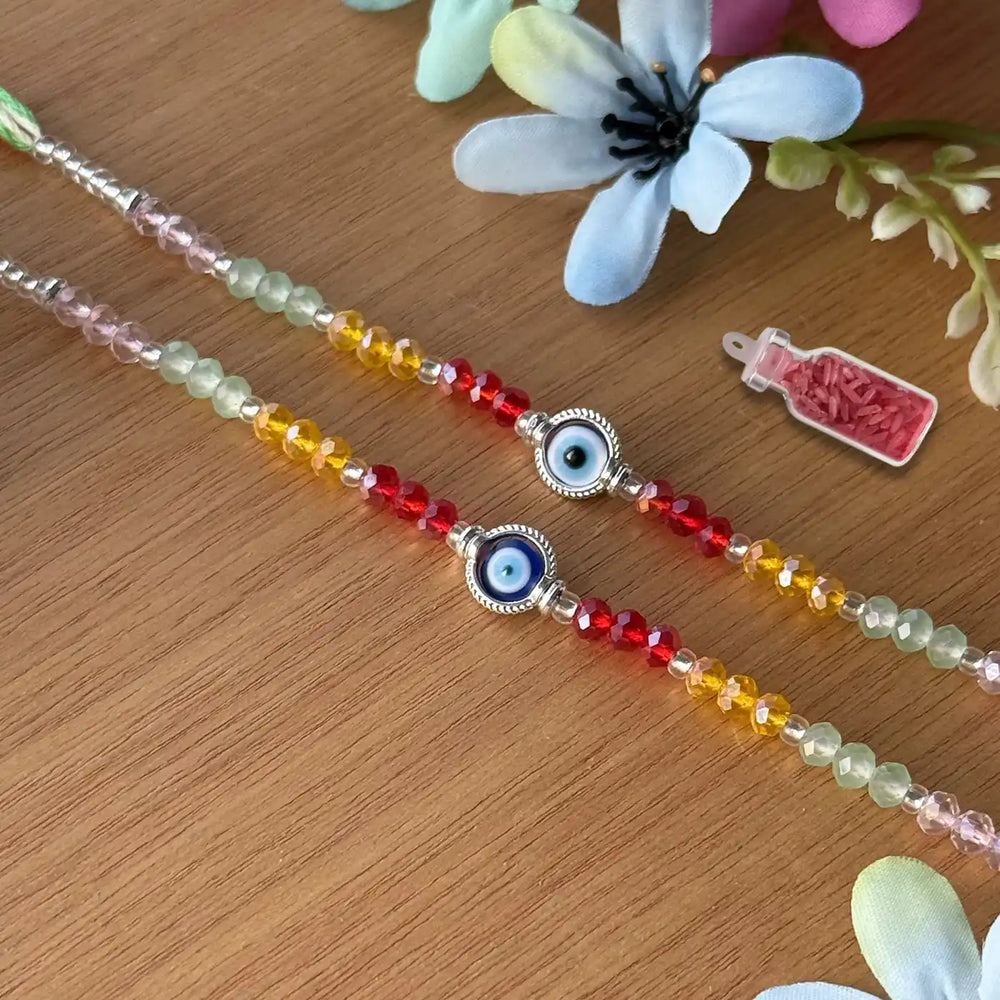 Handmade Round Beaded Evil Eye Rakhi With Roli Chawal - Laid Flat with Decoration