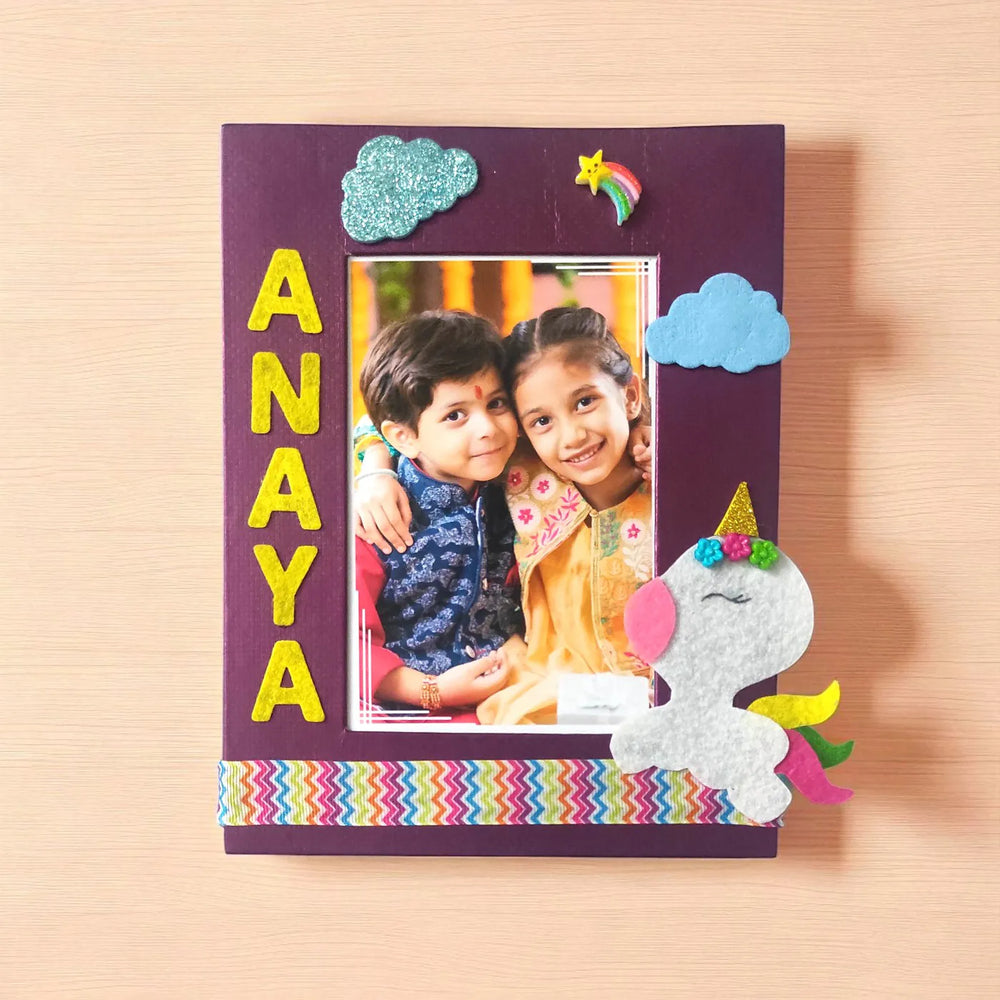 Photo Personalized Unicorn Theme Felt Rakhi Hamper With Roli Chawal Includes 1 Photo Frame 1 Rakhi - Photo Frame on Wooden Surface