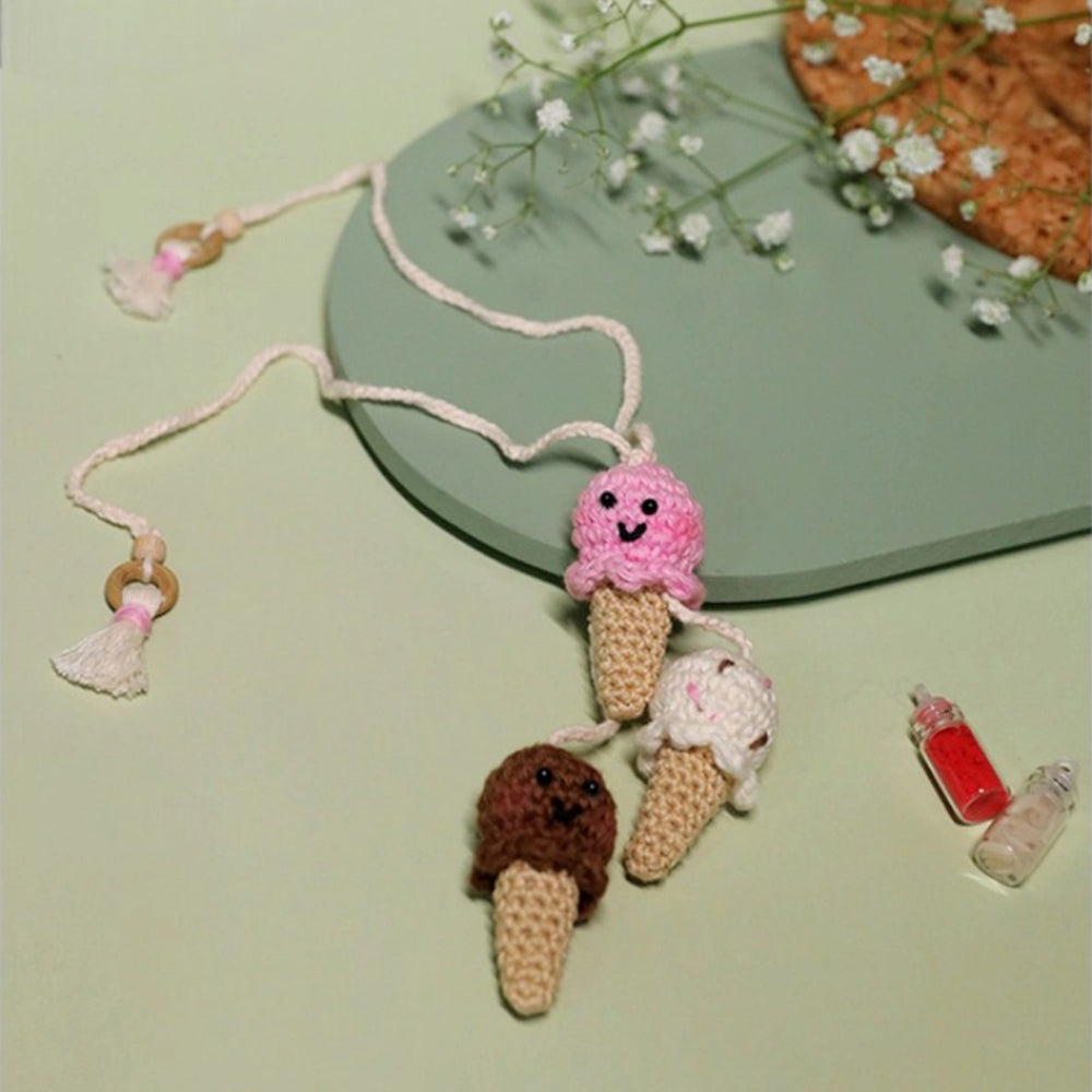 Handmade Crochet Triple Scoop Kids Lumba Rakhi For Girls With Roli Chawal - Full view with decorative background