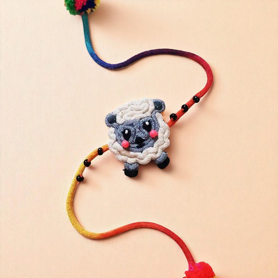 Handmade Dori Work Ba Ba Black Sheep Kids Rakhi With Roli Chawal - Close-up View of Bracelet Detail