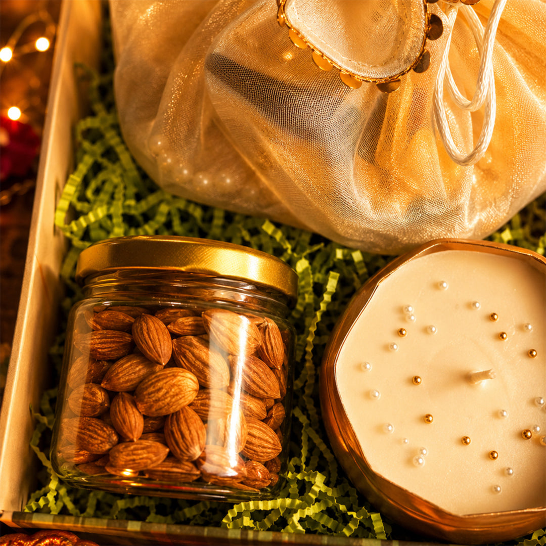 Emerald Festive Harvest Green Diwali Gift Hamper With Toran Potli, Urli Candle And Almonds For Festive Gifting