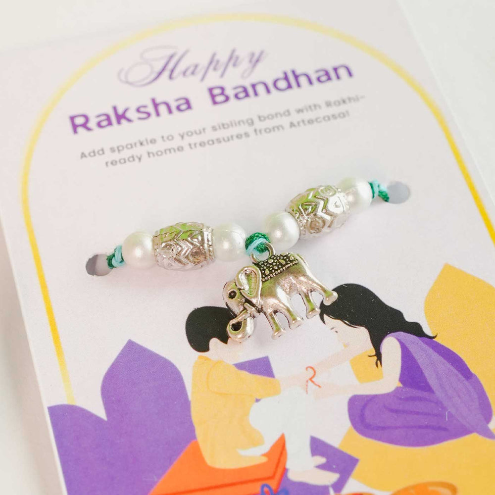 Personalized Handmade Crochet White Lily Rakhi Hamper Includes 1 Crochet Flower 1 Message Card And 1 Rakhi And Roli Chawal - Close-up of Rakhi on Card