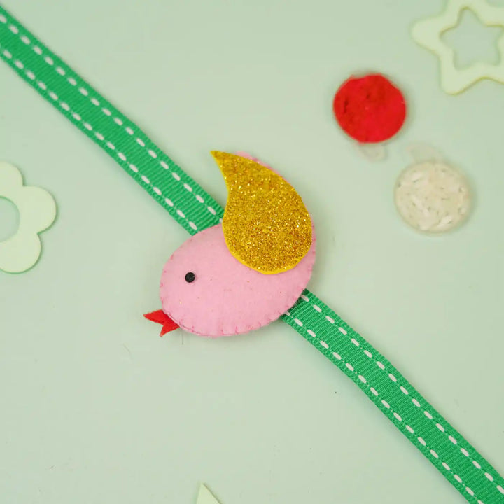 Handmade Bird Theme Felt Kids Rakhi With Roli Chawal - Bird accessory on green ribbon