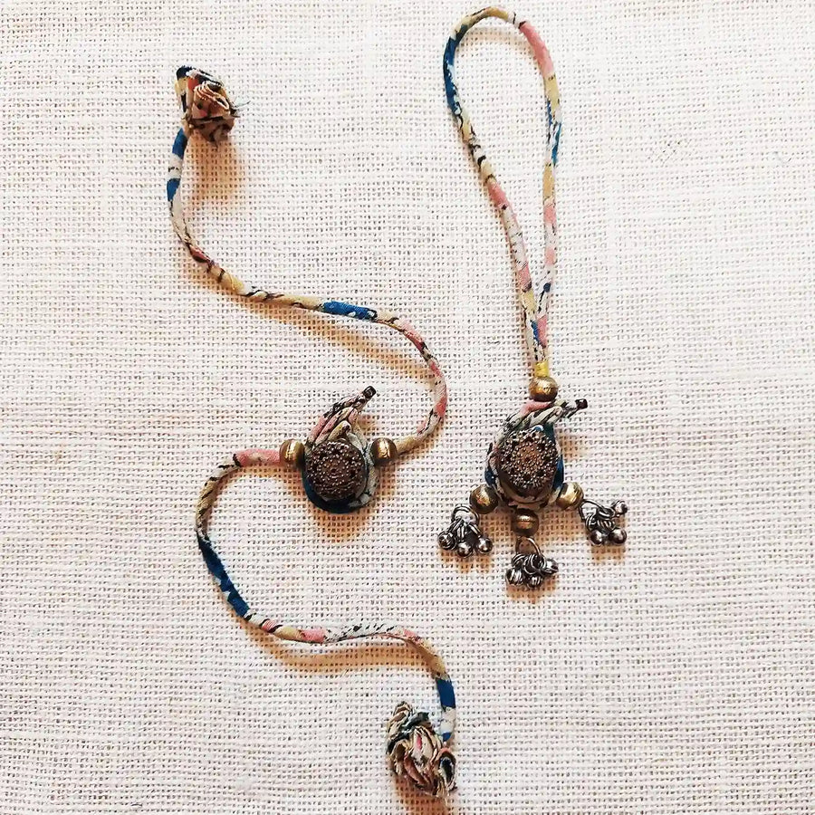 Handmade Dori Work Classic Ambi Bhaiya Bhabhi Rakhi With Roli Chawal Set Of 2 - Flat Lay View