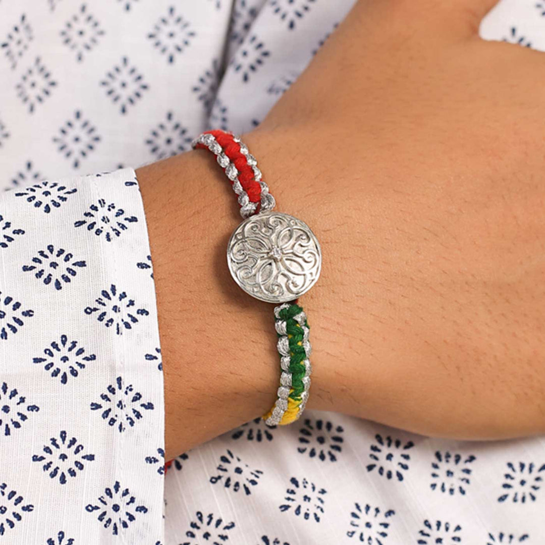 Handmade Swirl Design Silver Rakhi For Brother - On Wrist Model