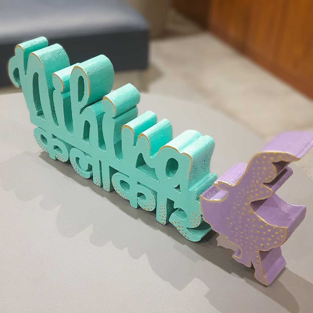 Personalized Handmade Kalakaar Wooden Cutout Name Plate - Angled Side View on Surface
