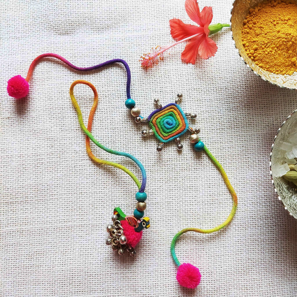 Handmade Dori Work Peacock And Ghungroo Bhaiya Bhabhi Rakhi With Roli Chawal Set Of 2 - Decorative necklace with turmeric bowl