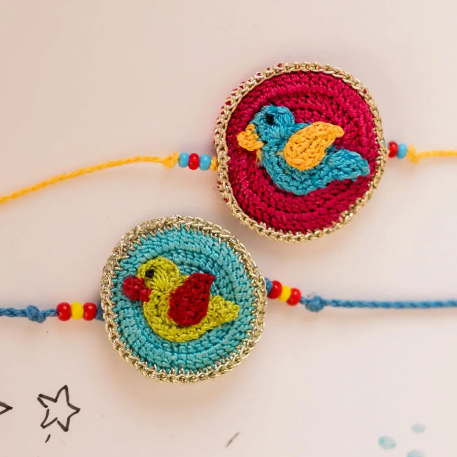 Handmade Crochet Birds Theme Kids Rakhi With Roli Chawal Set Of 2 - Close-up of Embroidered Bird Charms