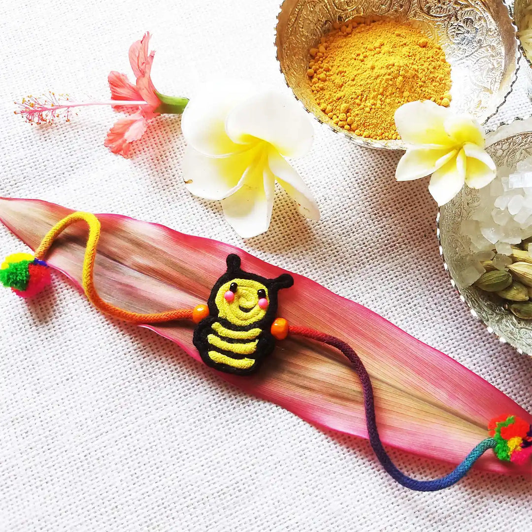 Handmade Dori Work Cute Bumble Bee Kids Rakhi With Roli Chawal - Styled with Decorative Items