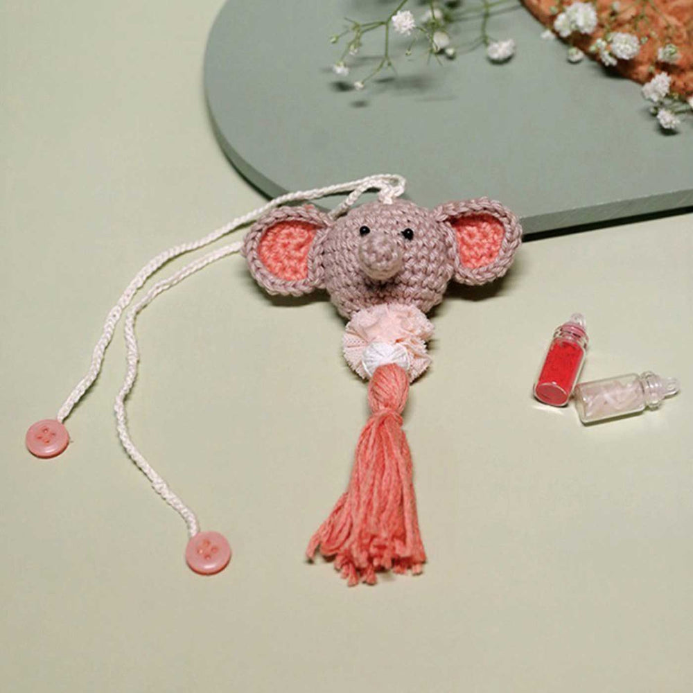 Handmade Crochet Dumbo Kids Rakhi With Roli Chawal - Close-up with Accessories