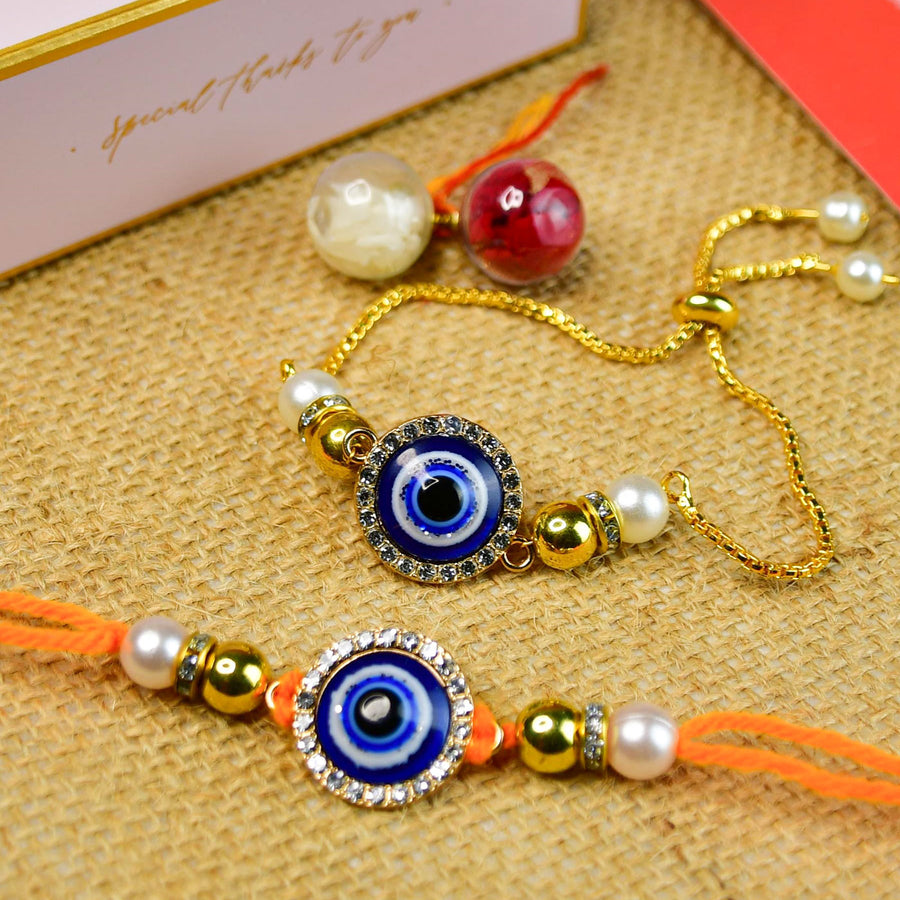 Beaded Blue Evil Eye Rakhi Hamper With Chocolates And Roli Chawal For Bhaiya And Bhabhi Customizable Options Includes Up To 7 Goodies - Close-up of two bracelets