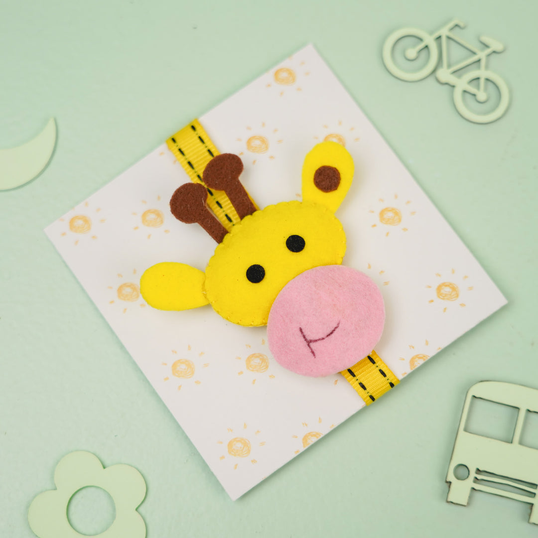 Handmade Giraffe Theme Felt Kids Rakhi With Roli Chawal - Top View on Decorative Card