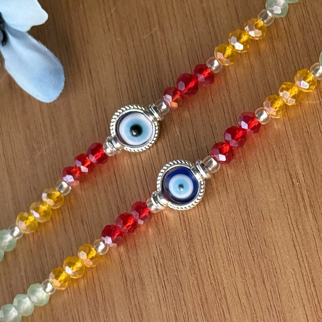 Handmade Round Beaded Evil Eye Rakhi With Roli Chawal - Close-up of Center Beads