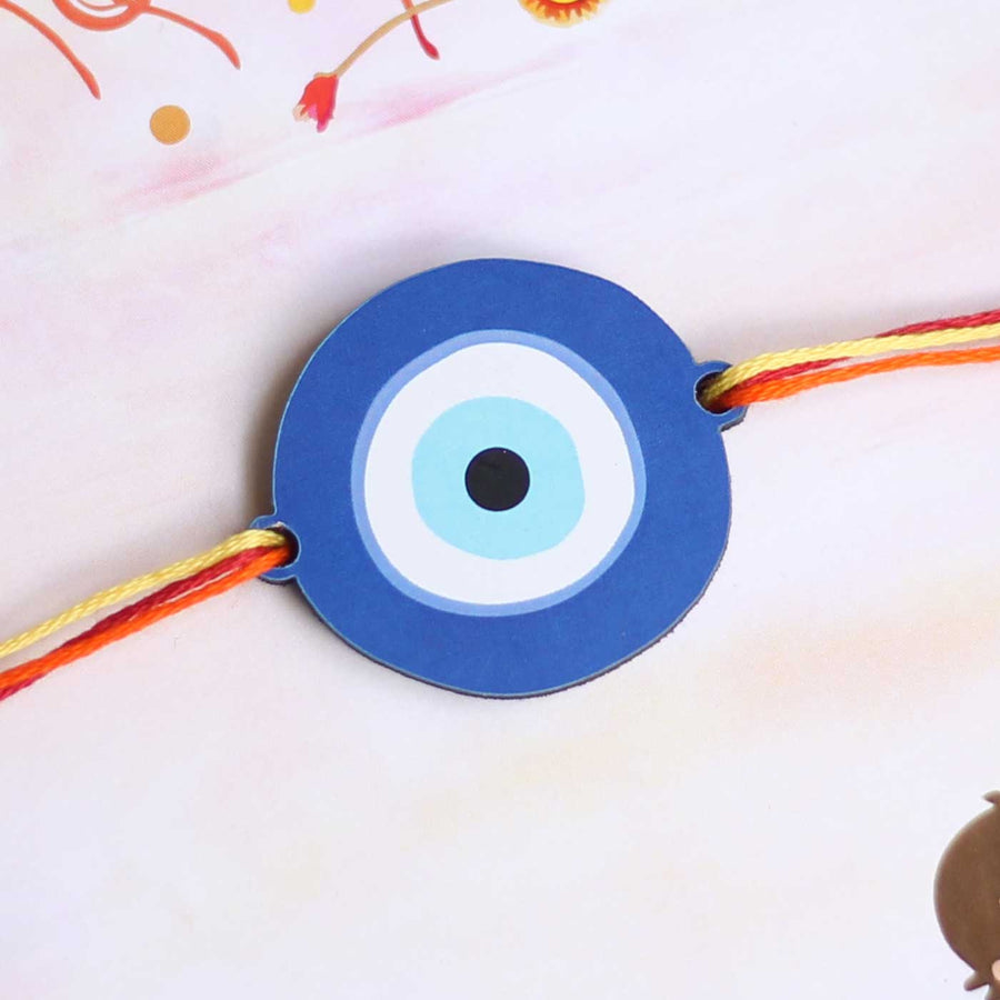 Handmade Evil Eye Design Magnet Wooden Rakhi With Roli Chawal - Close-up View of Evil Eye Charm