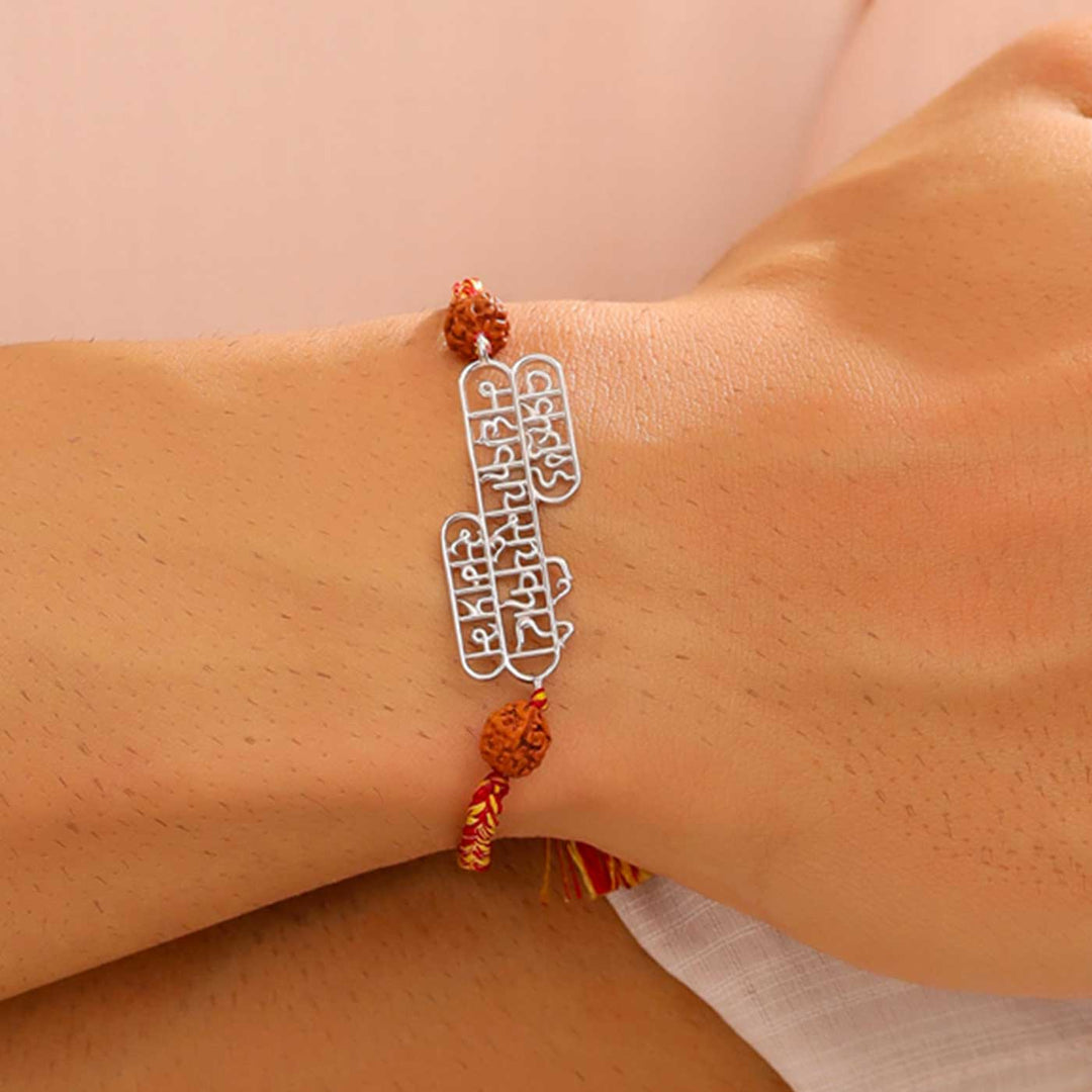 Handmade Ganesha Vandana Religious Silver Rakhi For Brother - On Wrist Display