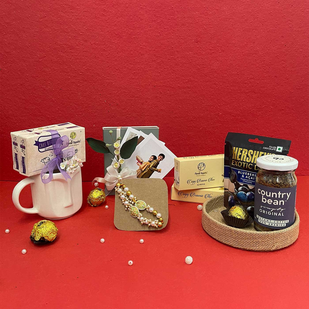 Photo Personalized Handmade Crumbs And Chaos Rakhi Hamper Includes 1 Mug 2 Biscotti 5 Photos 2 Brownies 1 Marble Lotus 1 Chocolate 1 Coffee And 1 Set Bhaiya Bhabhi Rakhi - Gift Set Arrangement