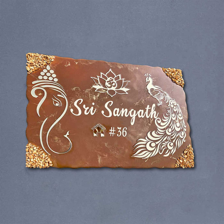 Personalized Metallic Brown Ganesha And Peacock Theme Resin Name Plate - Front View on Wall Background