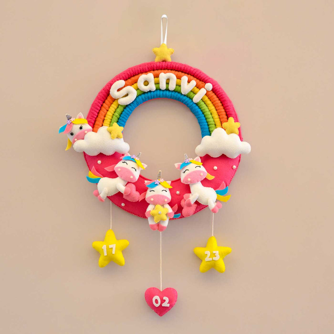 Personalized Rainbow And Unicorn Theme Round Felt Kids Nameplate - Front View Hanging on Wall