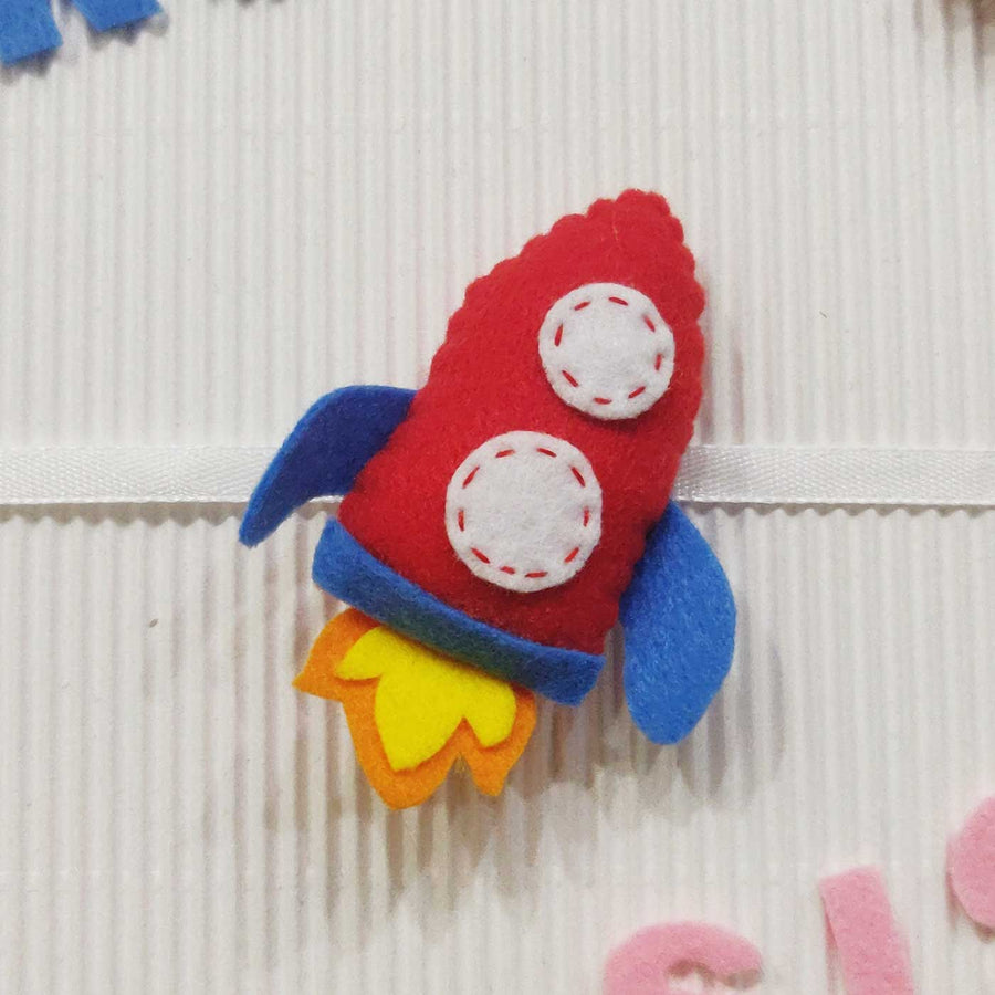 Handmade Rocket Theme Felt Kids Rakhi With Roli Chawal - Close-up of Rocket Toy