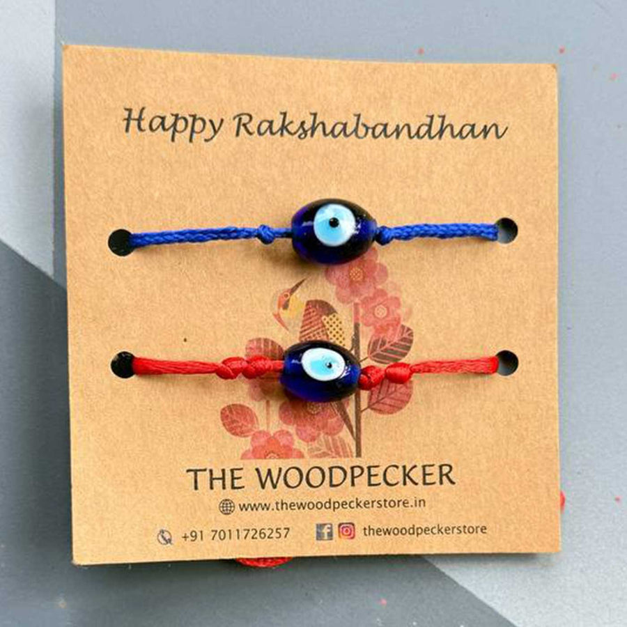 Personalized Hand Painted Evil Eye Rakhi With Roli Chawal Set Of 2 - Card Mounted Rakhi Pair Front