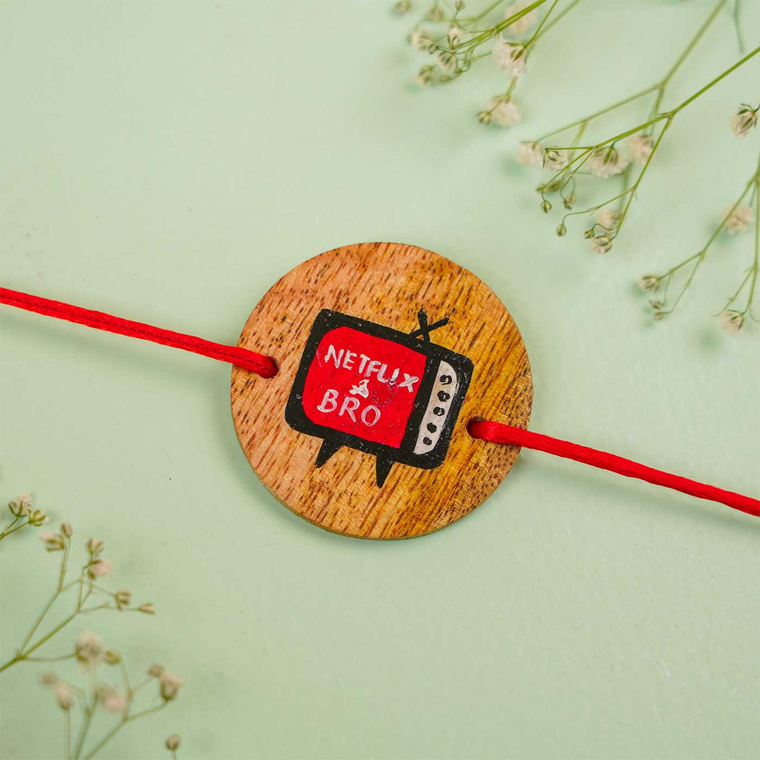 Personalized Hand Painted Netflix Bro Wooden Rakhi With Roli Chawal - Close-up on Flat Surface