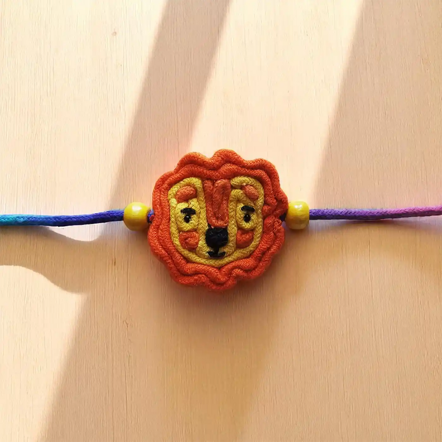 Handmade Dori Work Cute Lion Kids Rakhi With Roli Chawal - Close-up Front View