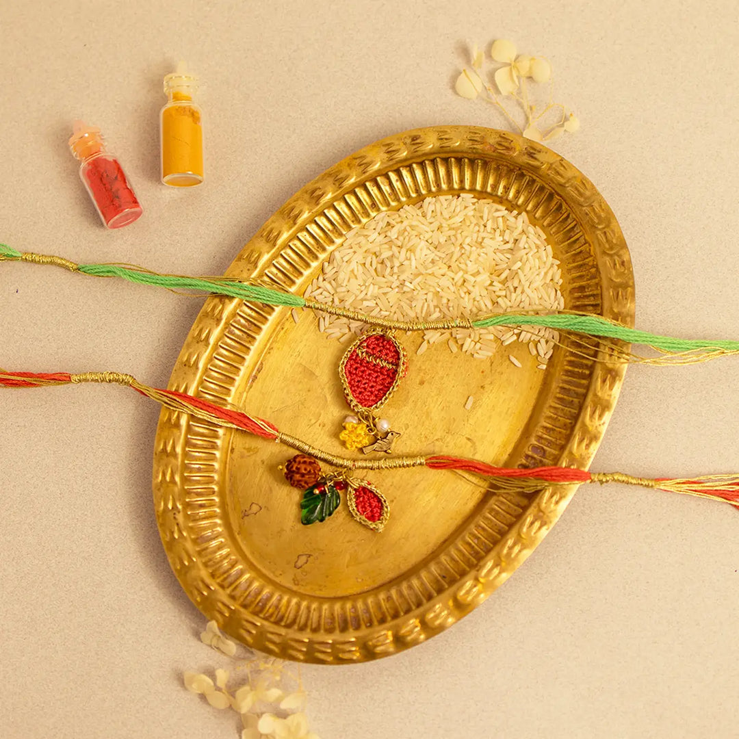 Handmade Crochet Ananya Paati Rakhi With Roli Chawal Set Of 2 - Decorative Flat Lay with Colors