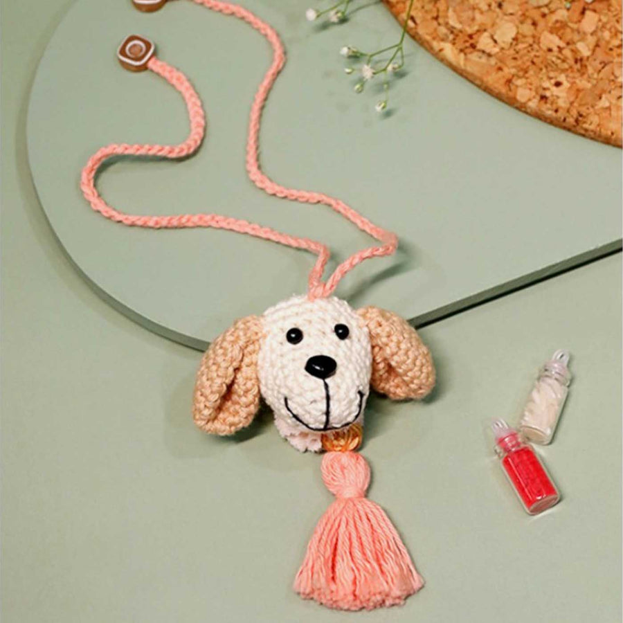 Handmade Crochet Puppy Love Kids Lumba Rakhi With Roli Chawal - Front View with Tassel