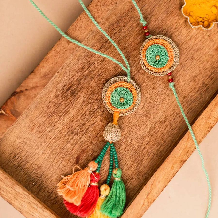 Handmade Crochet Rainbow Mandala Bhaiya Bhabhi Rakhi With Roli Chawal Set Of 2 - Close-up of Colorful Tassel Details