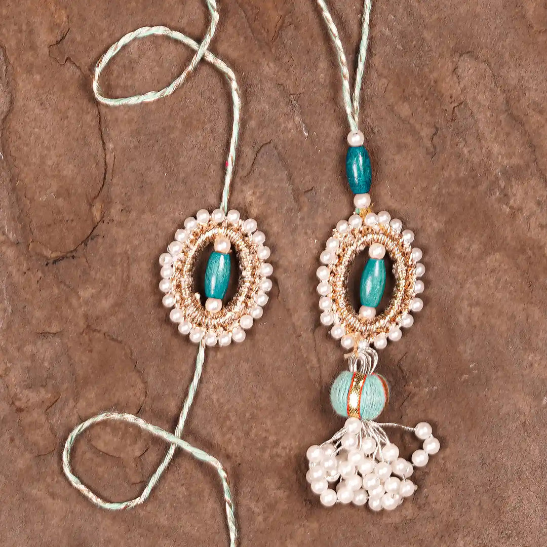 Handmade Beaded Subh Moti Bhaiya Bhabhi Rakhi With Roli Chawal Set Of 2 - Flat Lay Close-up
