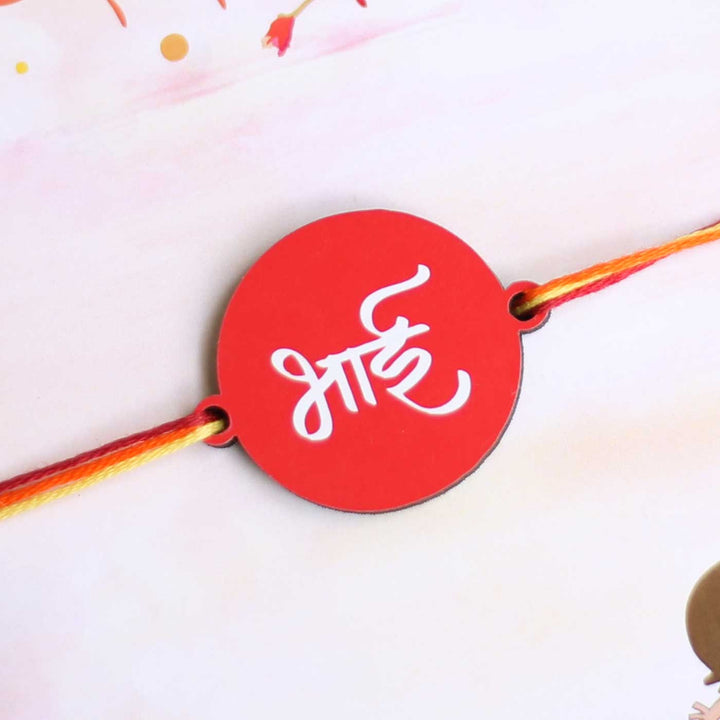 Handmade Bhai Magnet Wooden Rakhi With Roli Chawal For Brother - Close-up of Rakhi Charm