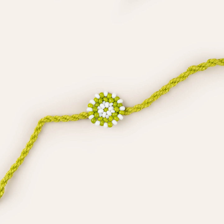 Handcrafted Glass Beads Chaand Rakhi 2 - Close-up of Green Beaded Rakhi