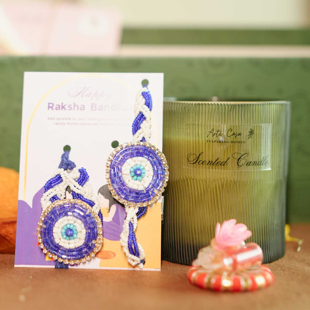 Personalized Handmade Love Theme Rakhi Hamper Includes 1 Gift Box 1 Mug 2 Rakhis 1 Roli Chawal 1 Candle And 1 Message Card - Rakhi and Candle Close-up