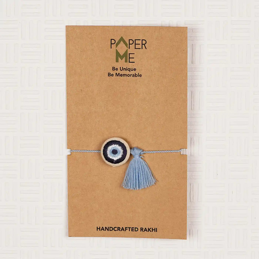 Hand Embroidered Evil Eye Rakhi With Roli Chawal - In Packaging on card backing