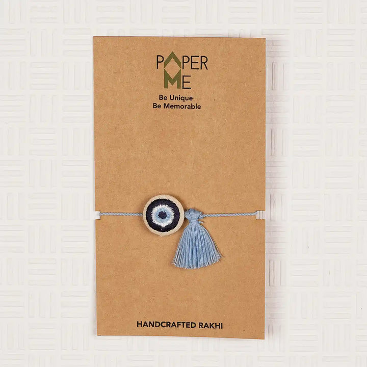 Hand Embroidered Evil Eye Rakhi With Roli Chawal - In Packaging on card backing