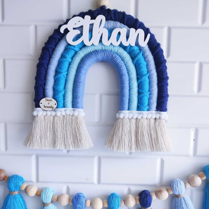 Personalized Handmade Macrame Blue Rainbow And Tassel Garland Combo Kids Name Plate And Bunting Combo With 3D Letters - Front View Hanging on Wall